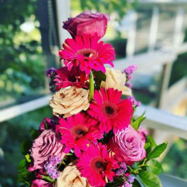 Tall bouquet of pink gerbera daisies and roses