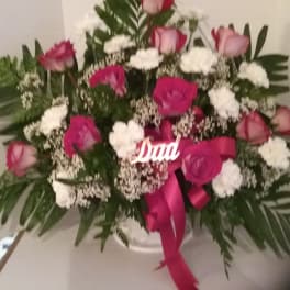 Pink and white rose arrangement with a ribbon and "Dad" sign