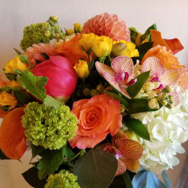 Bright mixed bouquet with orange, pink, yellow, and white flowers