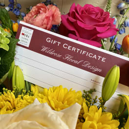 Gift certificate surrounded by colorful flowers including roses, tulips, and lilies