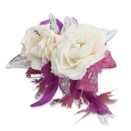 White rose corsage with purple ribbon and feather accents