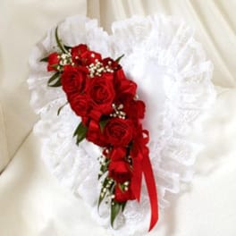 Red rose bouquet with white ruffled wrap and red ribbon