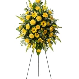 Yellow floral standing spray on an easel