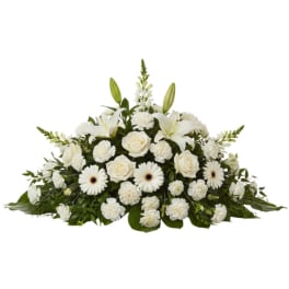 White floral spray with lilies, roses, and daisies