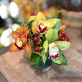 Bouquet of orchids in a small glass vase