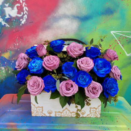 Box arrangement of pink and blue roses