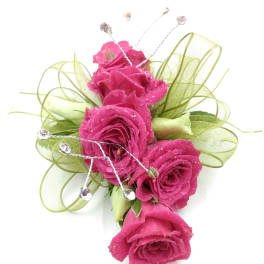 Pink rose corsage with green ribbon and rhinestone accents
