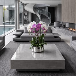 Potted orchids in white and purple on a modern table