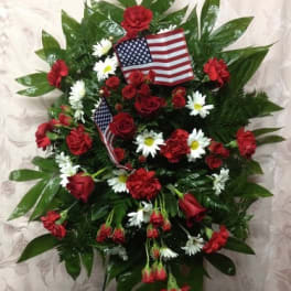 Red and white floral standing spray with American flags