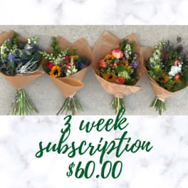 Four wrapped mixed flower bouquets on a marble background with subscription text