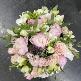 Bouquet of pink and white flowers with green foliage