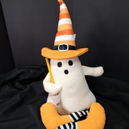 Halloween ghost plush wearing a striped witch hat and holding a broom