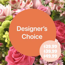 Pink roses and mixed blooms with a designer's choice label