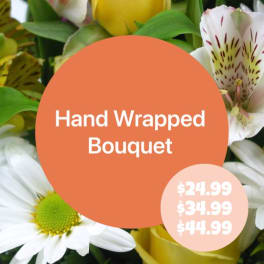 Hand wrapped bouquet with white daisies and spotted alstroemeria