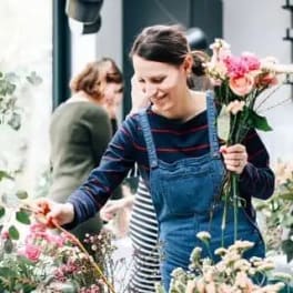 People arranging bouquets in a flower shop