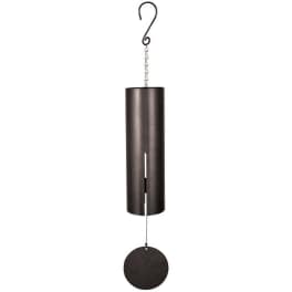 Black metal wind chime with a hanging round striker