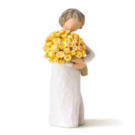 Figurine of a bride holding a bouquet of yellow roses