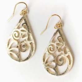 Pair of gold teardrop filigree earrings on a white background