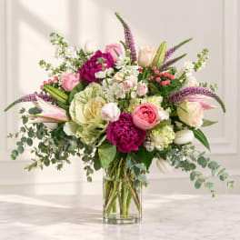 Mixed pink and white bouquet in a clear glass vase