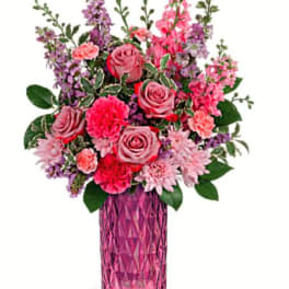 Pink and purple bouquet in a faceted pink vase