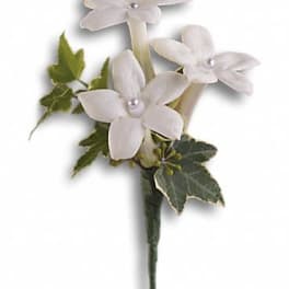 White flower boutonniere with ivy leaves
