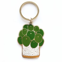 Potted plant keychain with green leaves and a gold ring