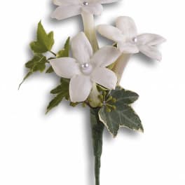 White flower boutonniere with ivy leaves
