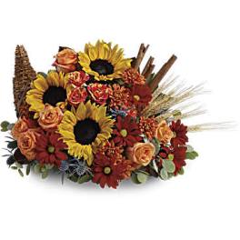 Sunflower and rose arrangement with red daisies and wheat accents