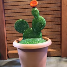 Ceramic cactus sculpture in a large pot