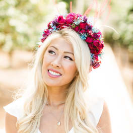 Woman wearing a pink and blue floral crown