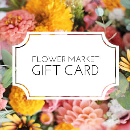 Flower market gift card design with white label over background of pink, yellow, and peach blossoms.