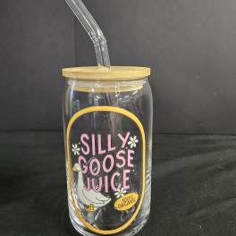 Clear glass tumbler with a bamboo lid and glass straw