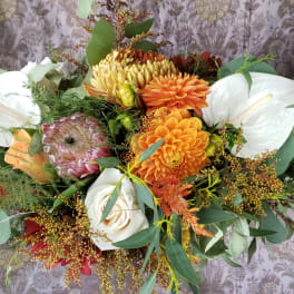 Mixed bouquet with white calla lilies and orange dahlias