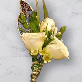 Cream rose boutonniere with green accents and decorative wire