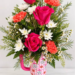 Pink roses and white daisies in a Halloween mug