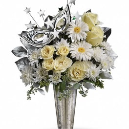 White and cream bouquet in a tall silver vase with star picks