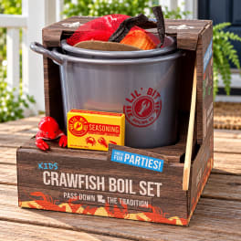 Crawfish boil set in a branded box with a pot, seasoning, and toy crawfish