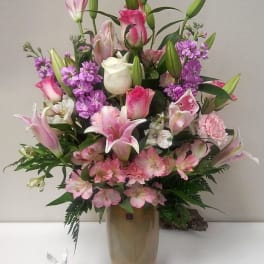 Pink and white mixed bouquet in a tall vase