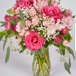 Pink mixed bouquet in a clear glass vase