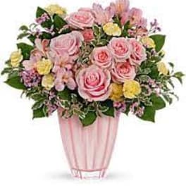 Pink rose bouquet in a tall pink vase