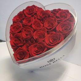 Heart-shaped box filled with red roses