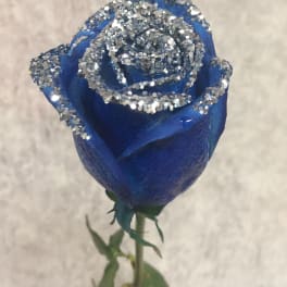 Single blue rose with silver glitter on the petals