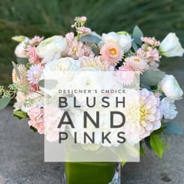 Blush and white mixed bouquet in a square glass vase