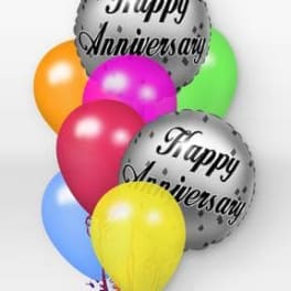 Cluster of colorful balloons with two silver Happy Anniversary balloons