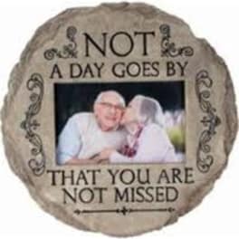 Decorative memorial plaque with a couple's photo and text