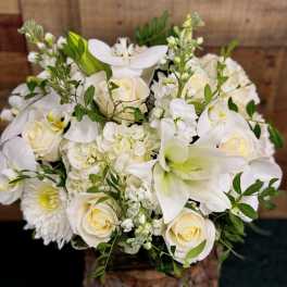 White floral bouquet with roses, lilies, and hydrangea