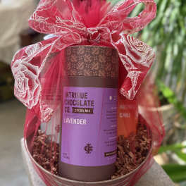Gift basket with cocoa mix and a pink ribbon bow