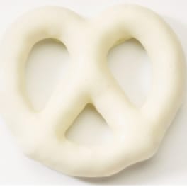 White pretzel-shaped snack on a plain background