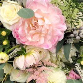 Pink and cream dahlia bouquet with white roses and greenery