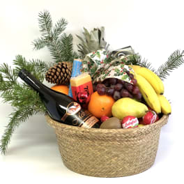 Gift basket with fruit, cheese, chocolate, and a wine bottle